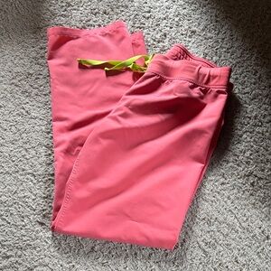 Figs Hot Coral Livingston M Pink scrub bottoms with Neon Green Tie
